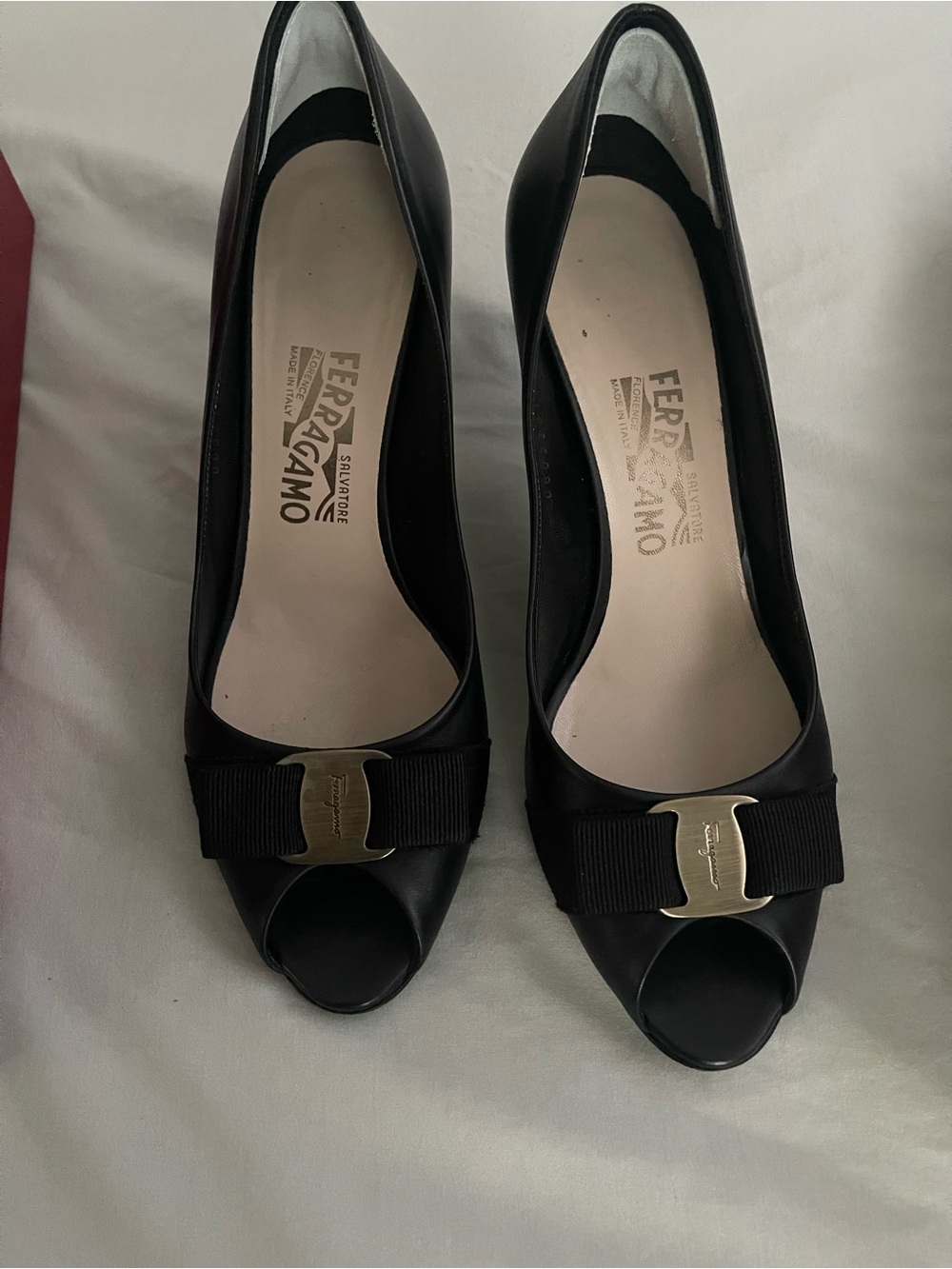 Salvatore Ferragamo Black Peep-Toe Pumps with Grosgrain Bow and Gold Plaque